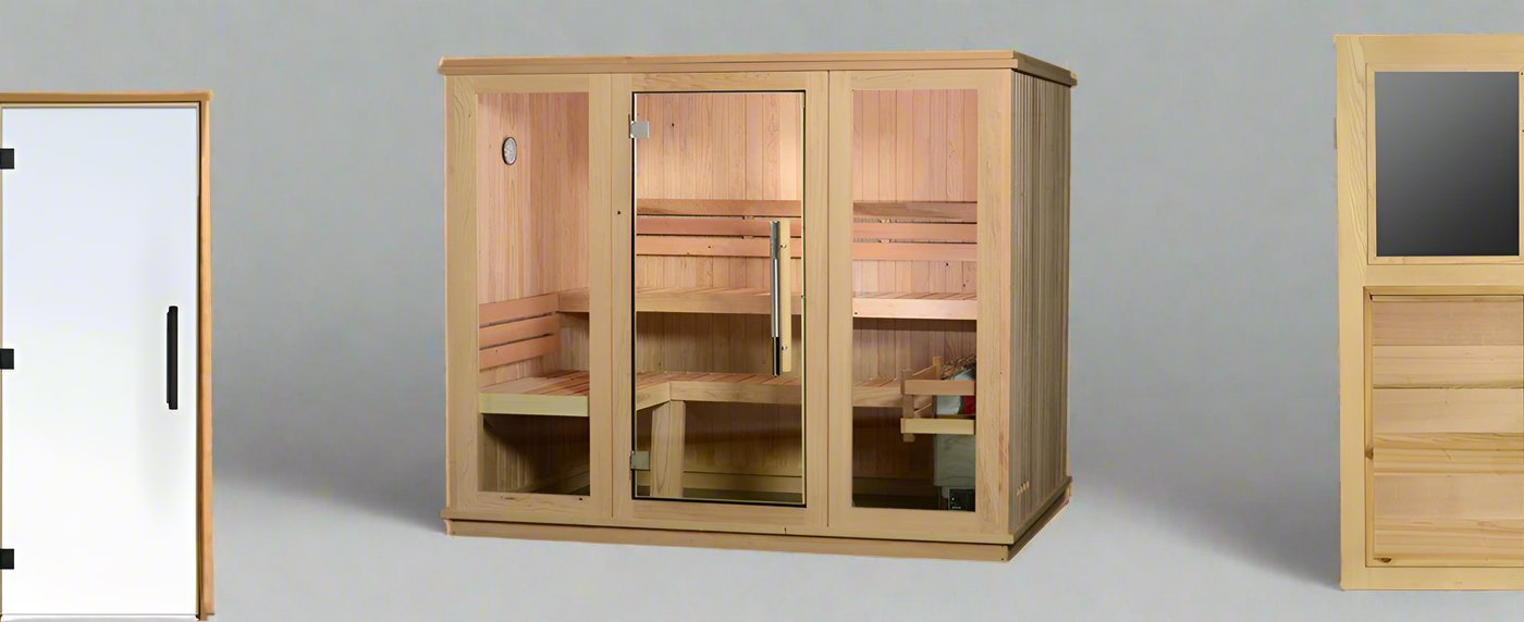 A light wood indoor cabin sauna with a glass front, flanked by a frosted glass door on the left and a wood-paneled door on the right against a grey background.