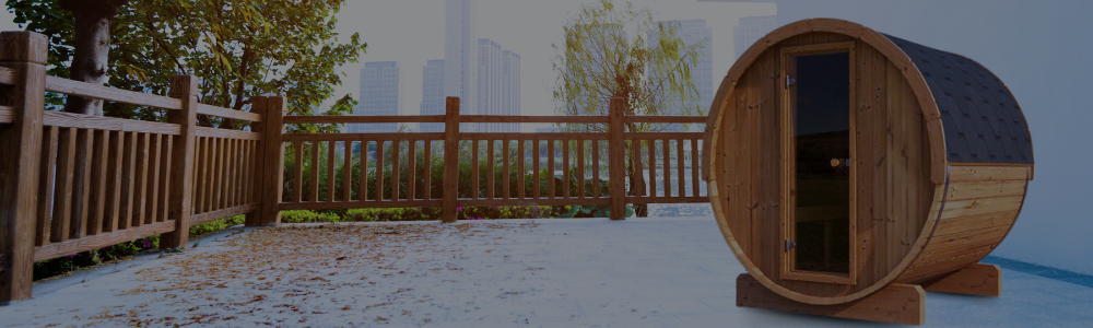 A Forever Saunas outdoor wooden barrel sauna with a glass door sitting on a patio with a cityscape background.