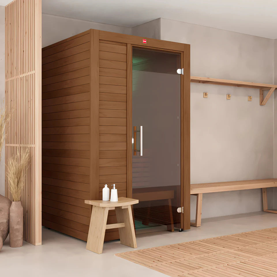 Wooden sauna in a room with a bench and shelves.
