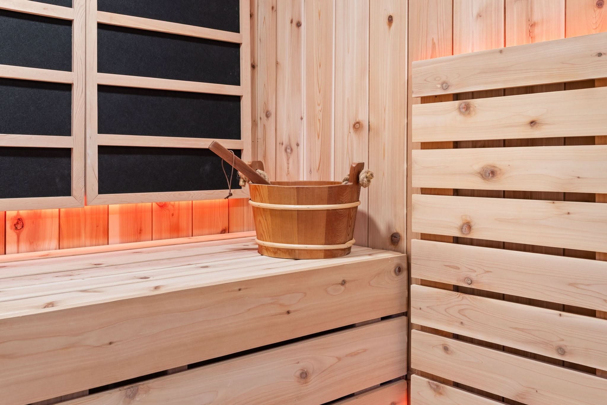 Sweaty Yeti 4-6 Person Outdoor Sauna & Cold Plunge Cabin with bucket and ladle.