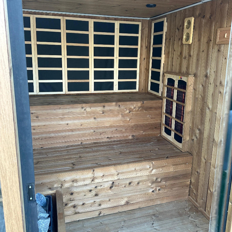 Wooden sauna with shelves and a bench inside as display