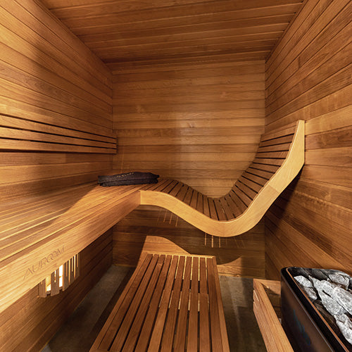 Wooden sauna interior with benches and asauna heater