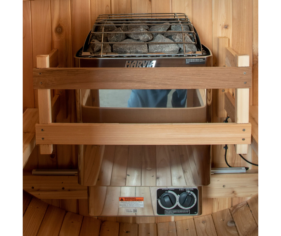 Front view of the wooden heater guard in front of a sauna heater and controls