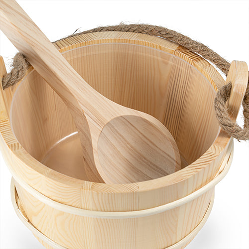 A light natural wood bath bucket with rope handles and a matching wooden spoon resting inside, shown on a clean white background.