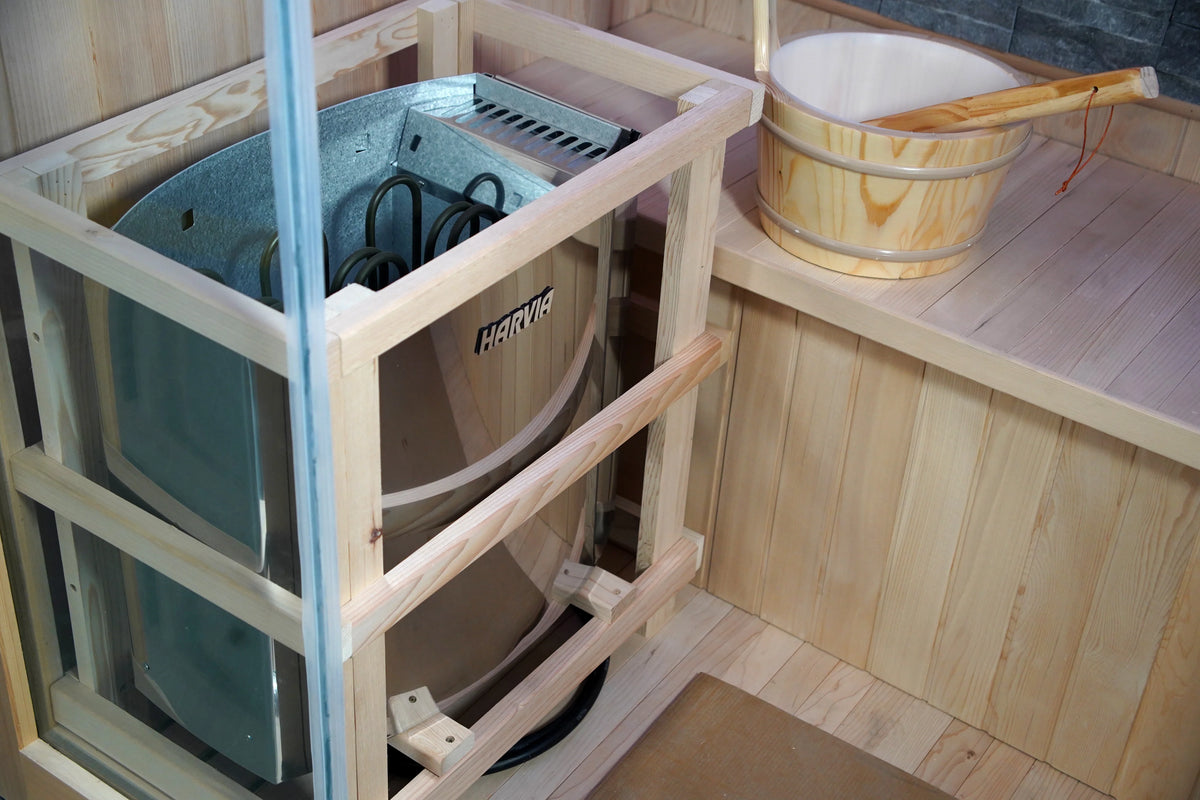 Wooden guard around the heater beside a water bucket in the Westlake