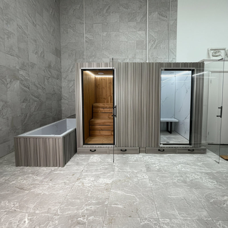 Premium indoor wellness cabin featuring a traditional sauna, glass-enclosed steam room.