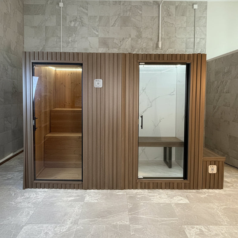 Contemporary spa room featuring a traditional sauna, steam room, and sleek glass partitions.