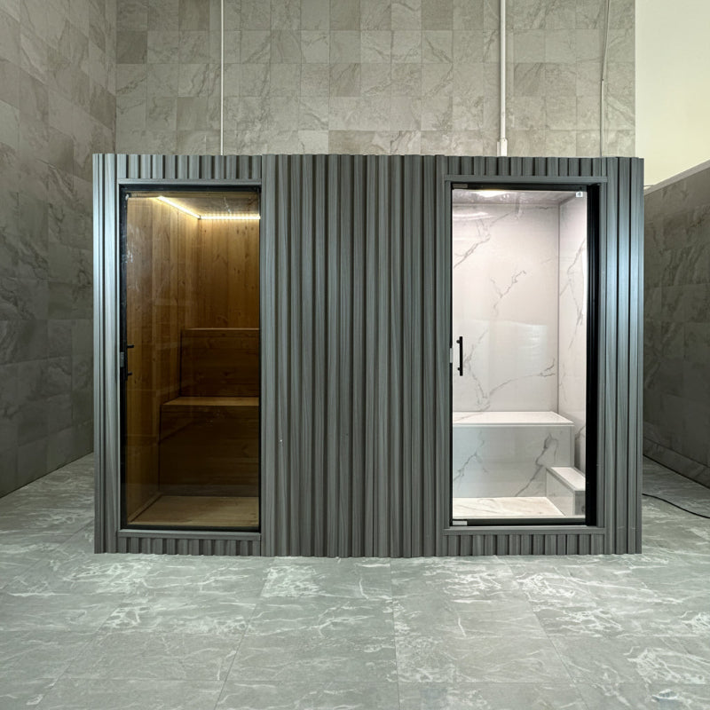 Spacious indoor sauna and steam room with wood paneling, glass enclosures, and ambient lighting.