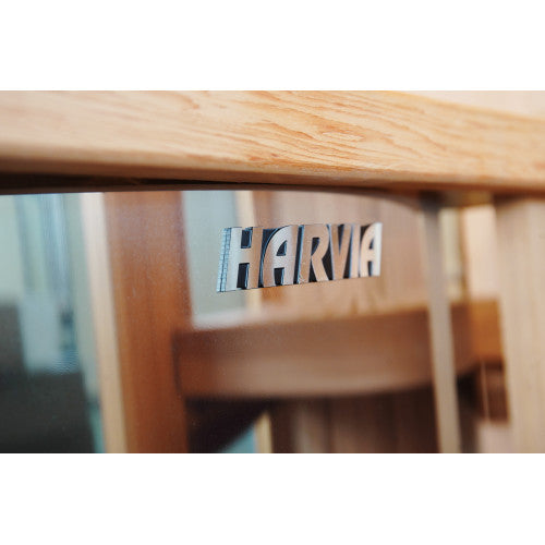 Wooden chair with 'Harvia' logo on a blurred background