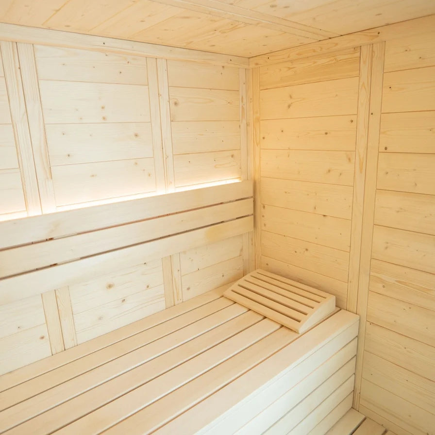 Wooden sauna interior with bench and window