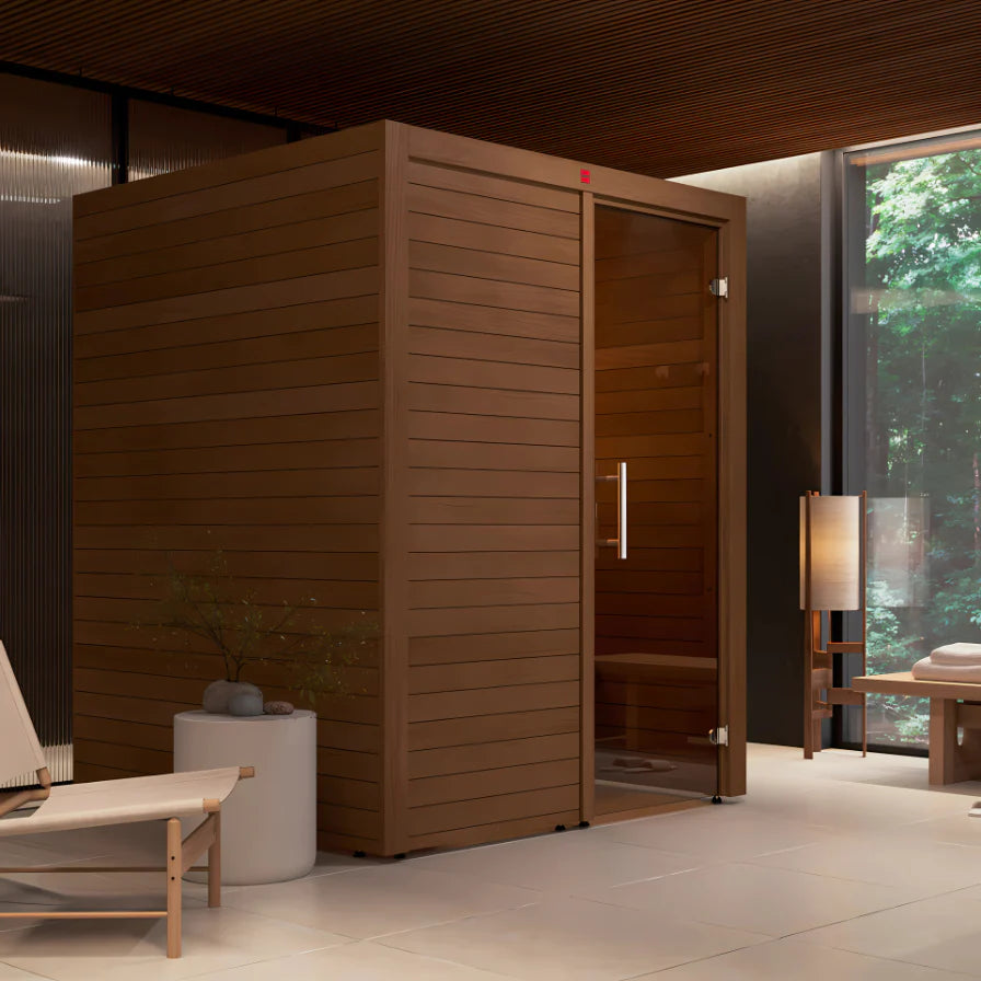 Wooden sauna in a modern room with a view of greenery outside