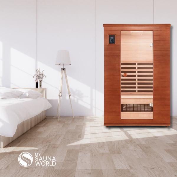 Health Mate Renew  2 Person Infrared Sauna beside  with a bedroom set up.