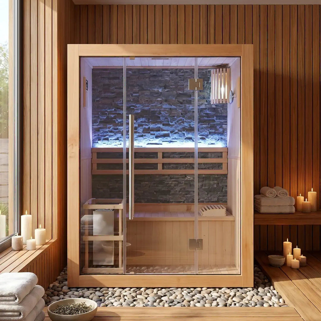 Sunray Rockledge 2-person indoor sauna on a pebble floor with candles