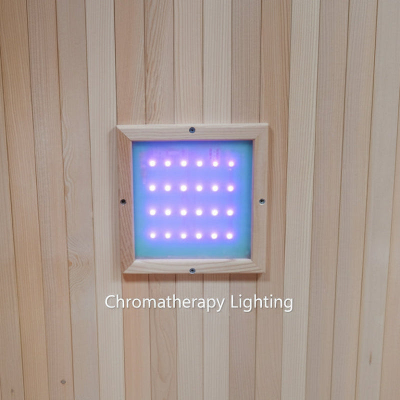 A square LED chromatherapy lighting panel mounted on a light wood-paneled wall, emitting a blue and purple light glow. The text 'Chromatherapy Lighting' is displayed at the bottom.