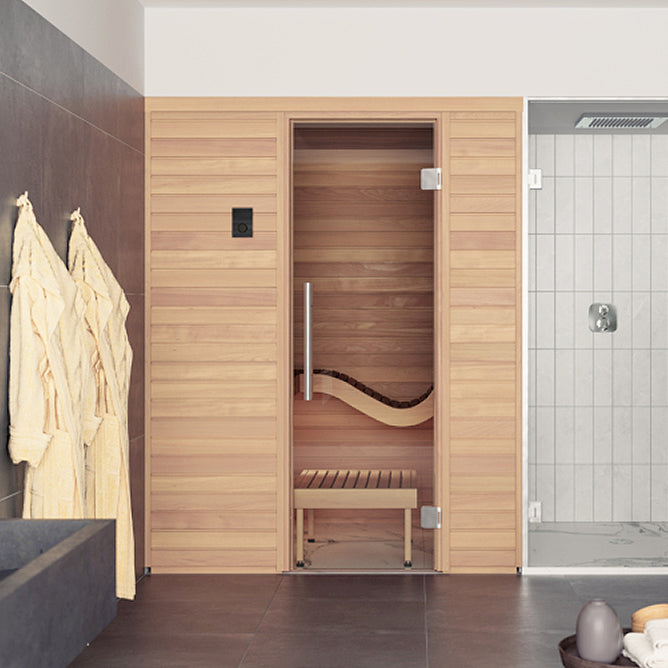 Auroom Baia Cabin Sauna - Thermo-Aspen Wooden sauna with a bench inside, towels hanging on the left, and a tiled shower area in the background.