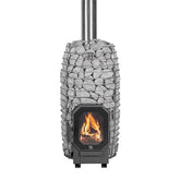 HUUM HIVE Flow Mini wood-burning sauna stove filled with stones, fire lit